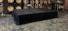 Skirted stage decks set up for an event