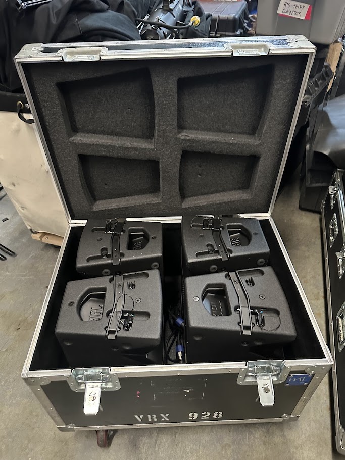 Rack of Shure QLXD wireless microphone receivers with antenna distribution